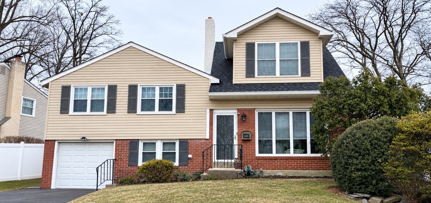 House with newly installed shingle roofing