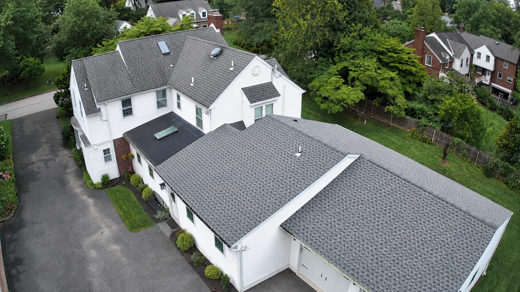 House with newly installed shingle roofing